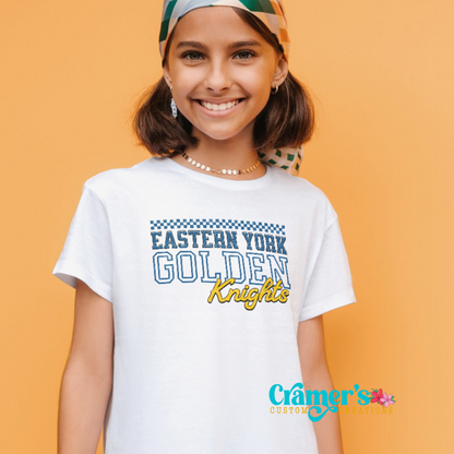 A young person wearing a white t-shirt with 'Eastern York Golden Knights' text printed on the front.