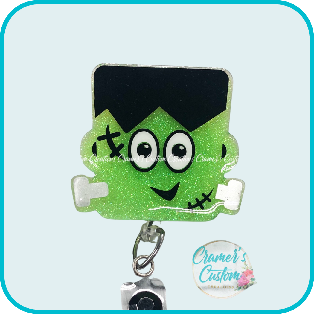 badge reel shaped like frankenstein that's lime green.