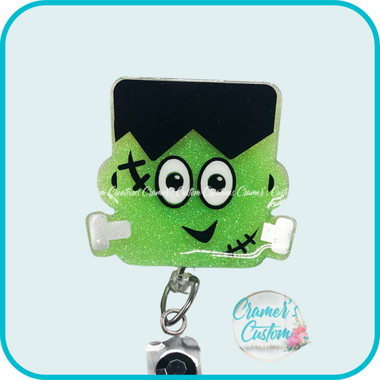 badge reel shaped like frankenstein that's lime green.