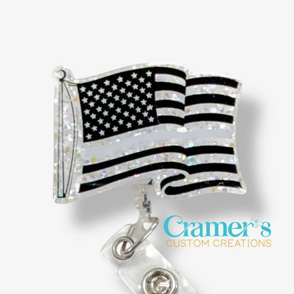 American flag badge reel with 'Cramer's Custom Creations' logo on a white background