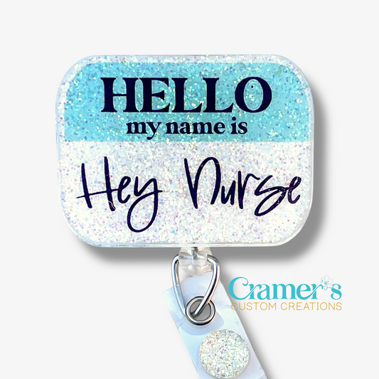 Name tag holder with 'HELLO my name is Hey Nurse' text on a blue and white background, featuring Cramer's Custom Creations logo.