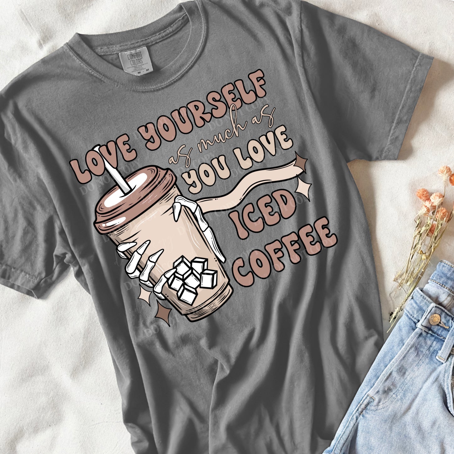 flat lay of a grey shirt that says love your self as much as you love iced coffee 