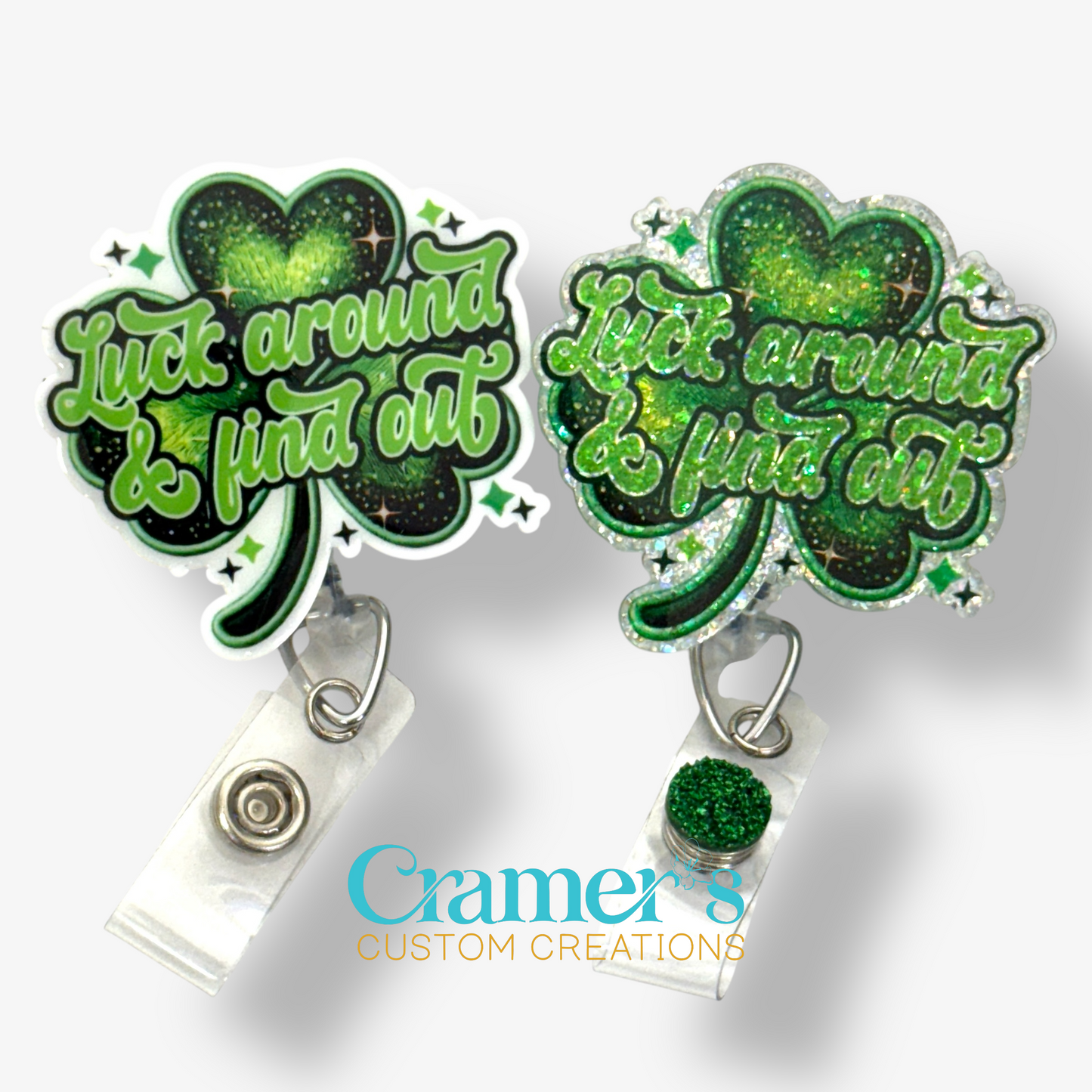 2 badge reels showing a glitter and a non glitter option of a shamrock that says luck around and find out