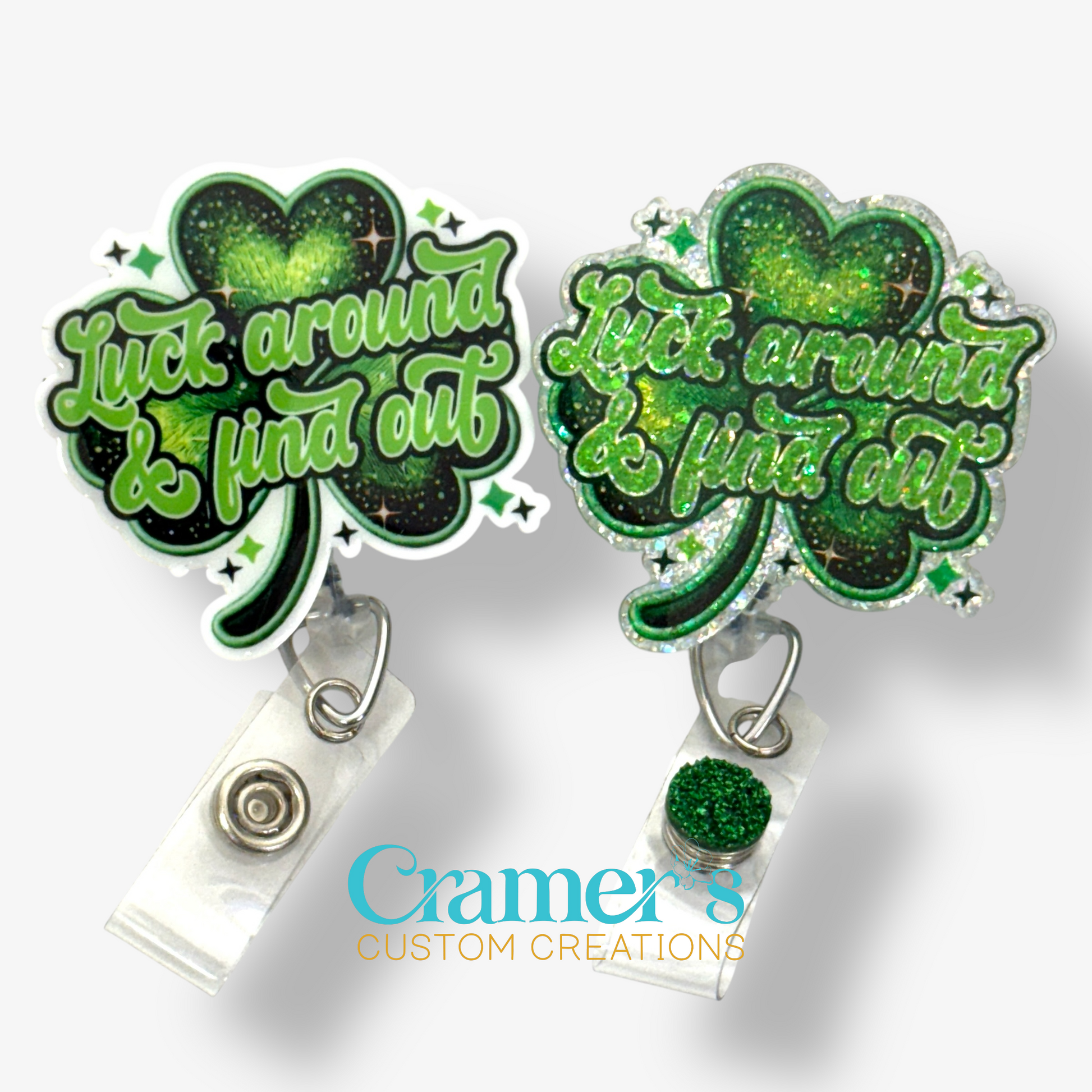 2 badge reels showing a glitter and a non glitter option of a shamrock that says luck around and find out