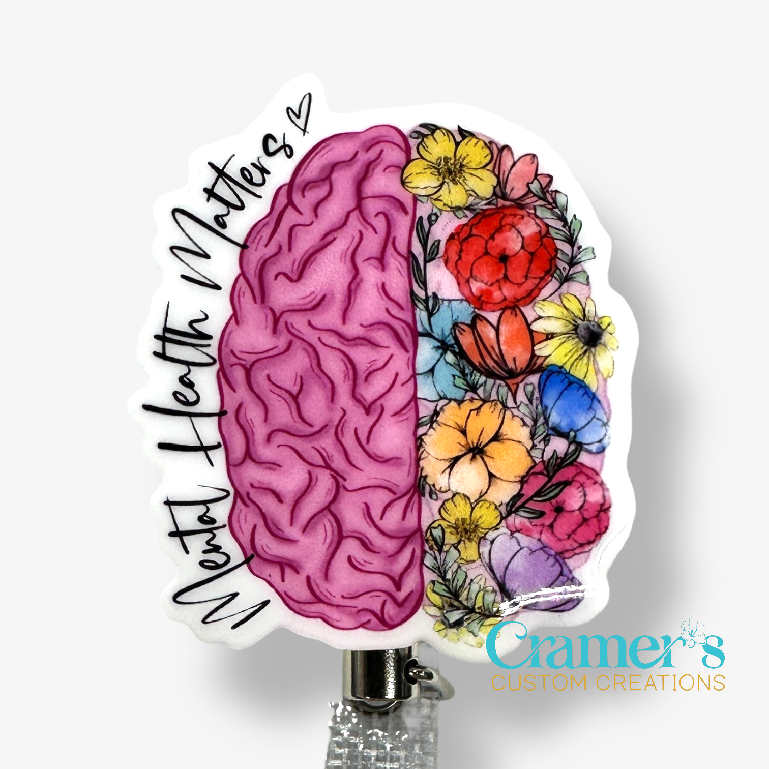 non glitter pink brain with flowers on the right side and mental health matters along the left side
