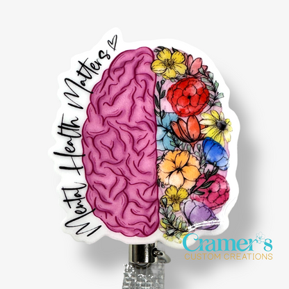 non glitter pink brain with flowers on the right side and mental health matters along the left side