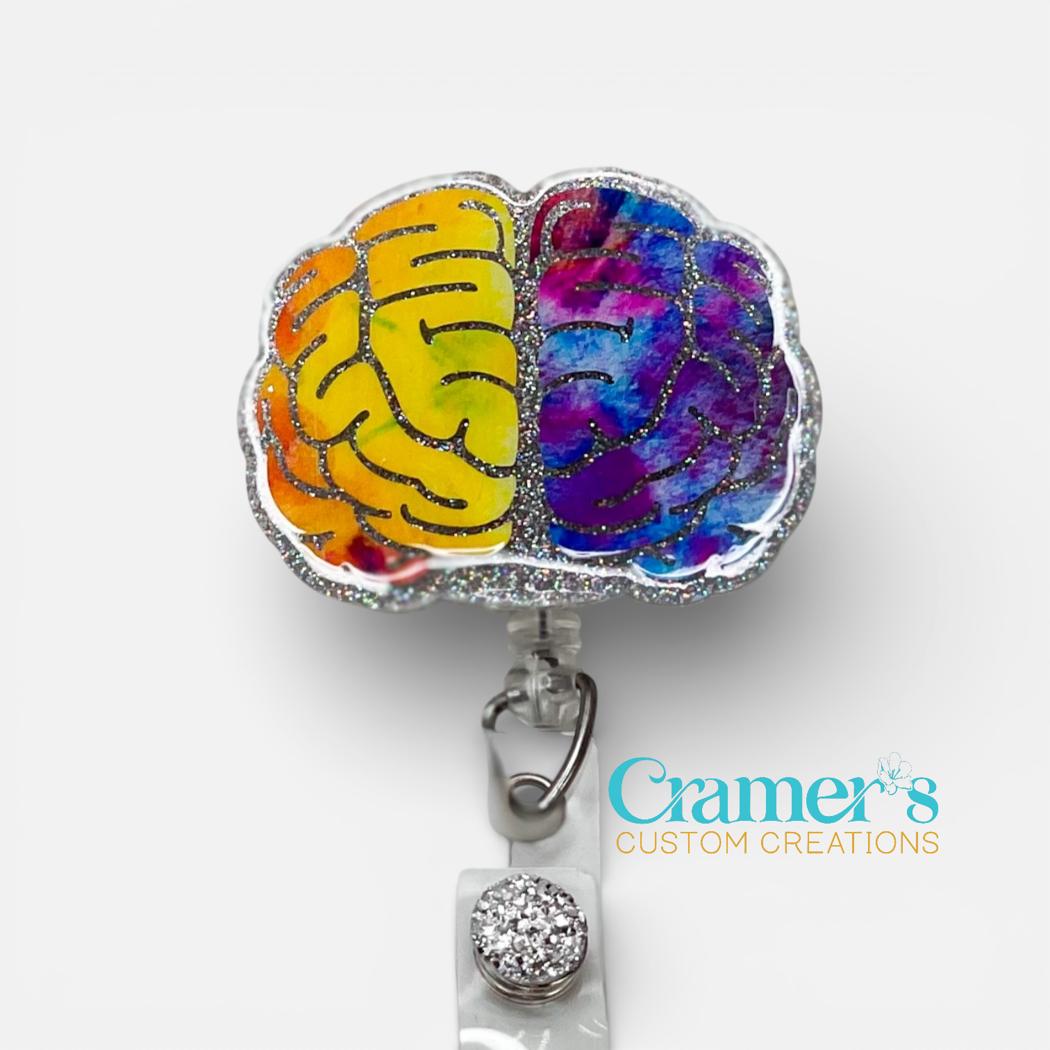 brain badge reel with multicolor vinyl and silver glitter
