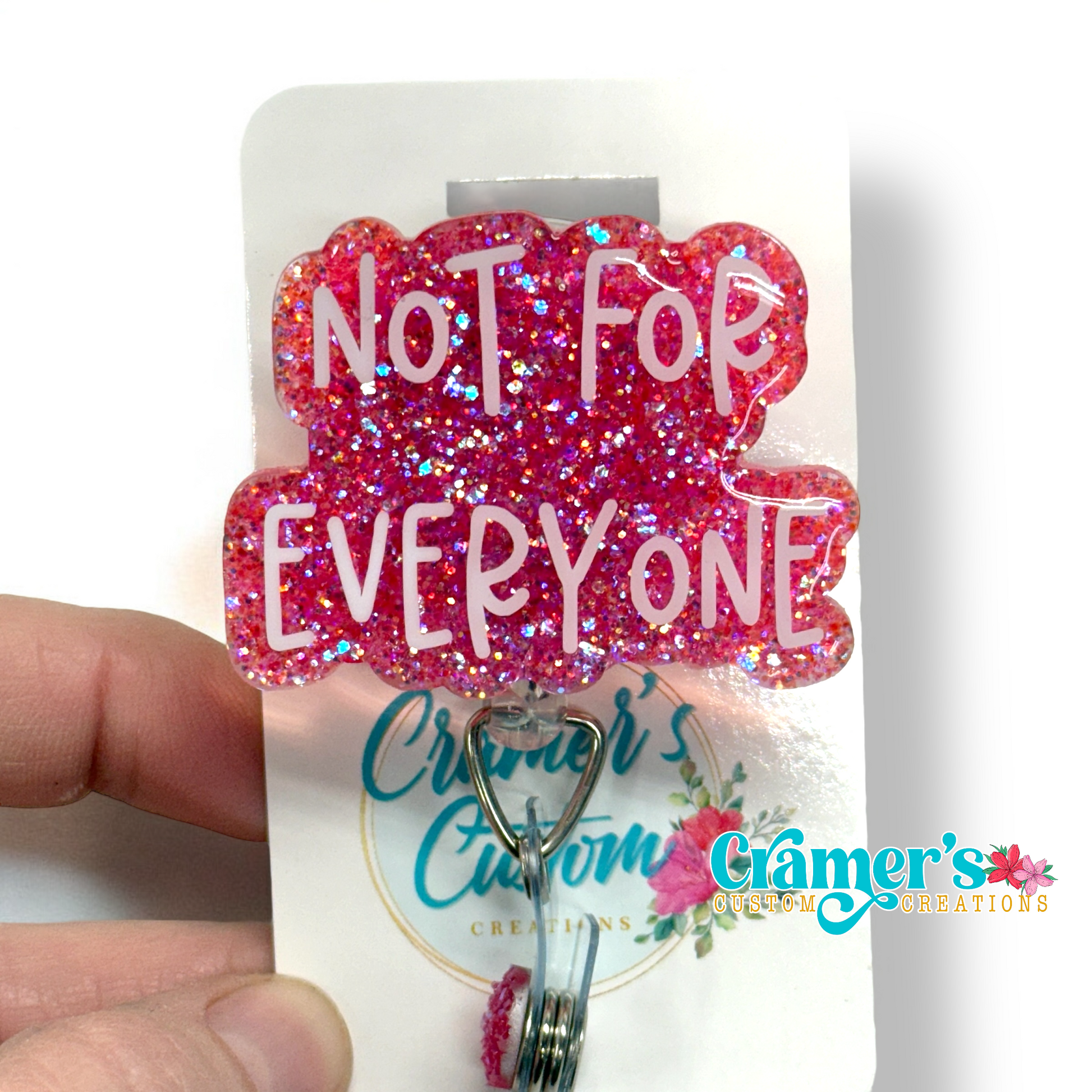 badge reel showing a pink glitter background with not for everyone in white