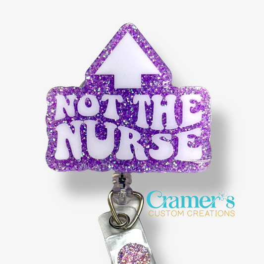 badge reel showing a purple glitter background with not the nurse in white with an arrow pointing up