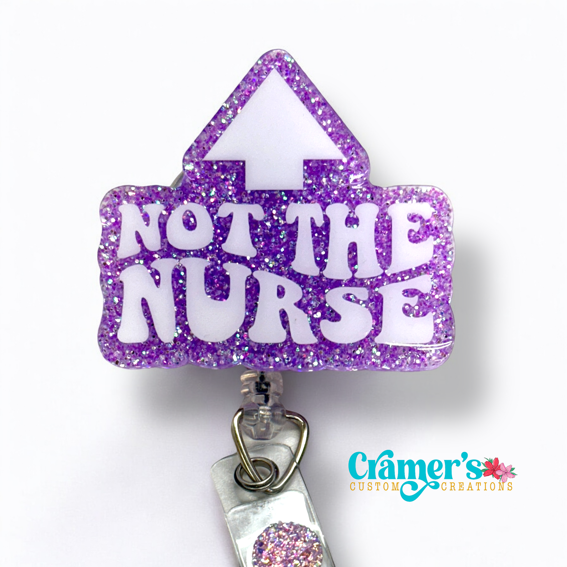 badge reel showing a purple glitter background with not the nurse in white with an arrow pointing up