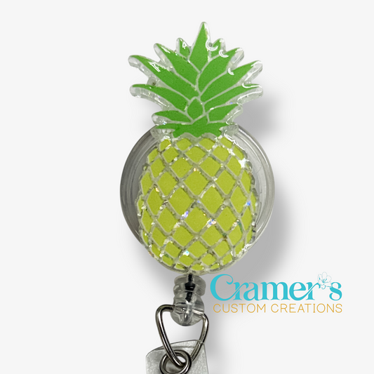 Pineapple-shaped badge holder with a white background and 'Cramer's Custom Creations' branding.