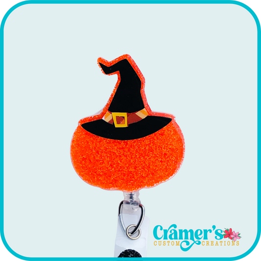 glittery orange pumpkin with a witch hat
