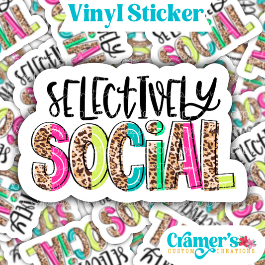Sticker laying flat that says  selectively social on a background of the same sticker stacked up