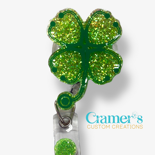 badge reel showing a green glitter background with stethoscopes made into a shamrock in darker green vinyl