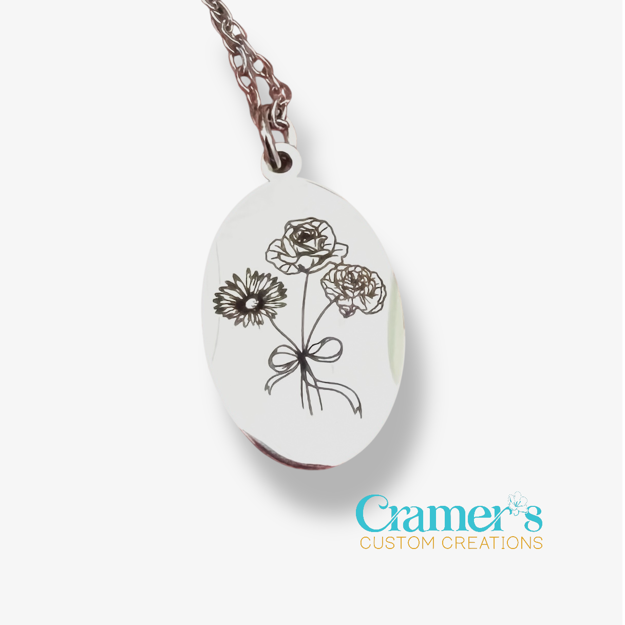 Necklace with floral pendant on a white background, featuring 'Cramer's Custom Creations' branding.