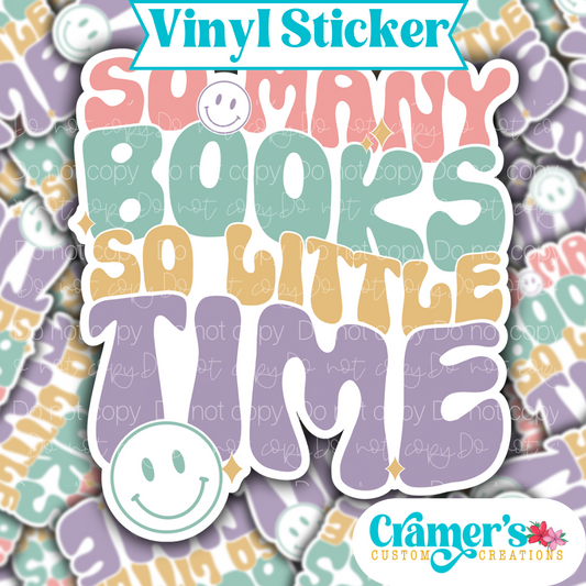 Sticker laying flat that says so many books so little time on a background of the same sticker stacked up