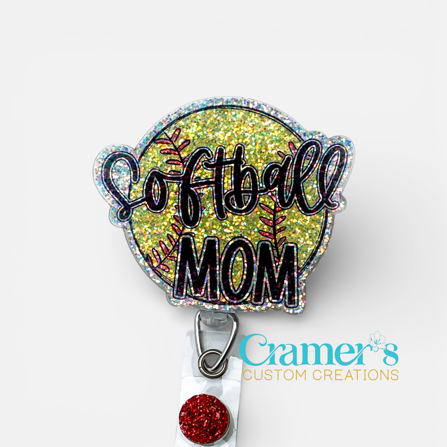 Glittery badge holder with 'Softball Mom' text and Cramer's Custom Creations logo.