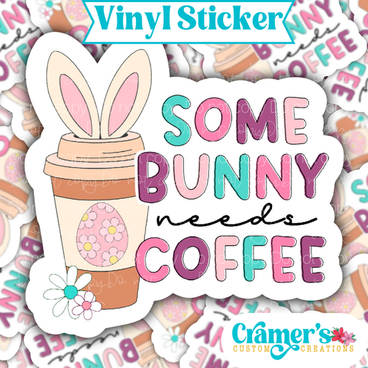 Sticker laying flat that says some bunny needs coffee sticker on a background of the same sticker stacked up