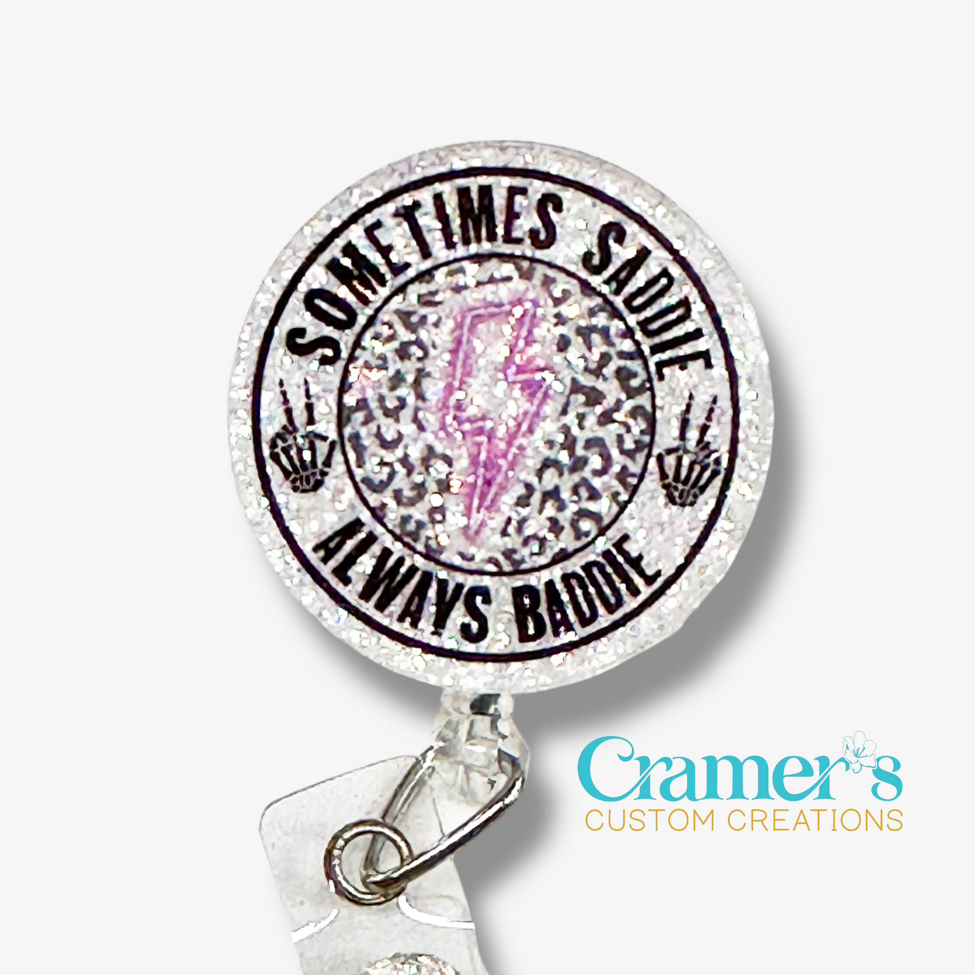 Retractable badge holder with 'Sometimes Sadie, Always Badass' text and Cramer's Custom Creations logo.