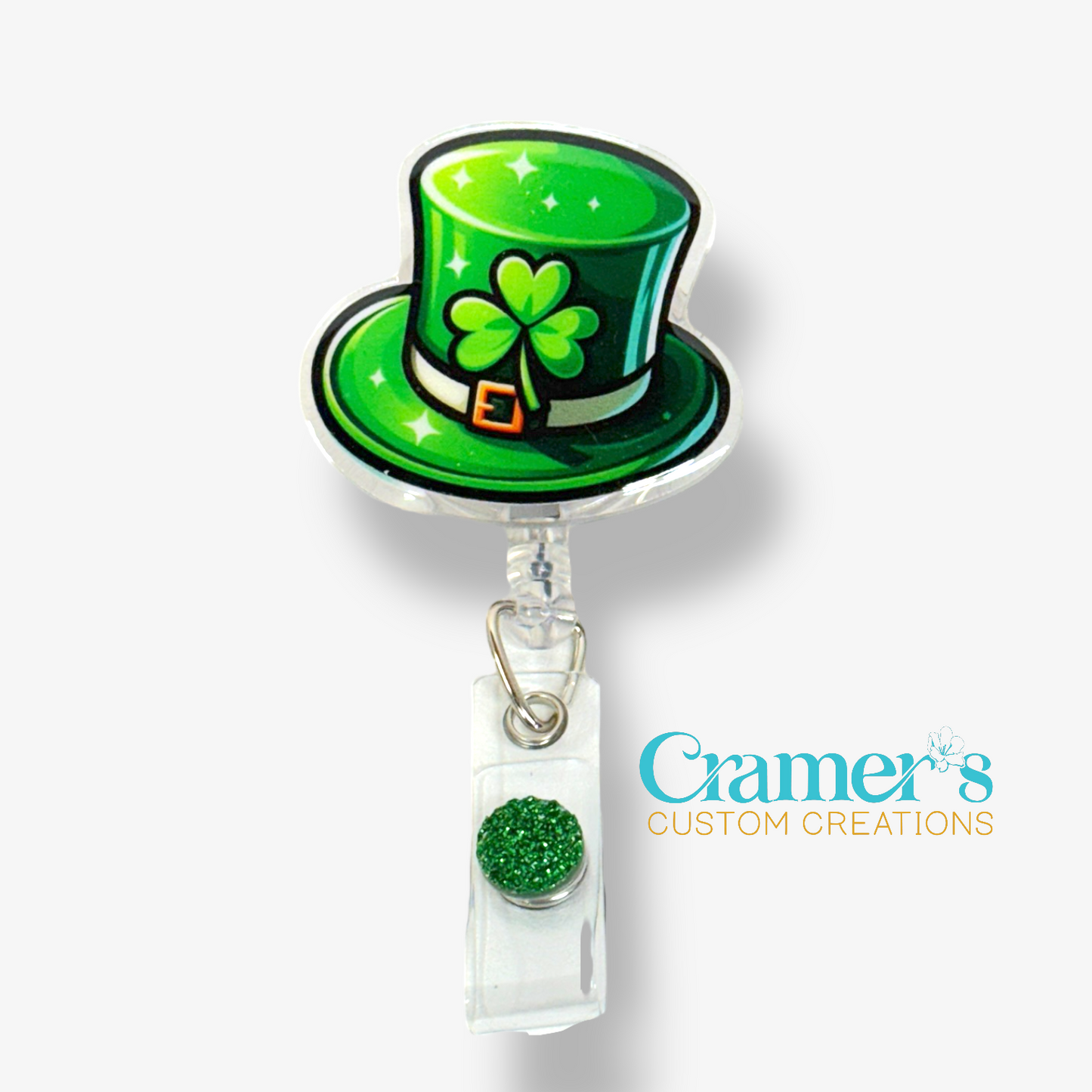 Green St. Patrick's Day hat badge holder with shamrock design on a white background.