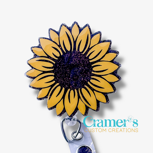 Sunflower-shaped badge holder with 'Cramer's Custom Creations' branding on a white background