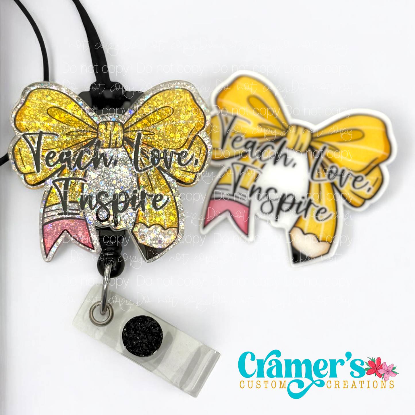 2 badge reels showing a glitter and a non glitter option of a badge with the words teach love inspire on a bow colored like a pencil