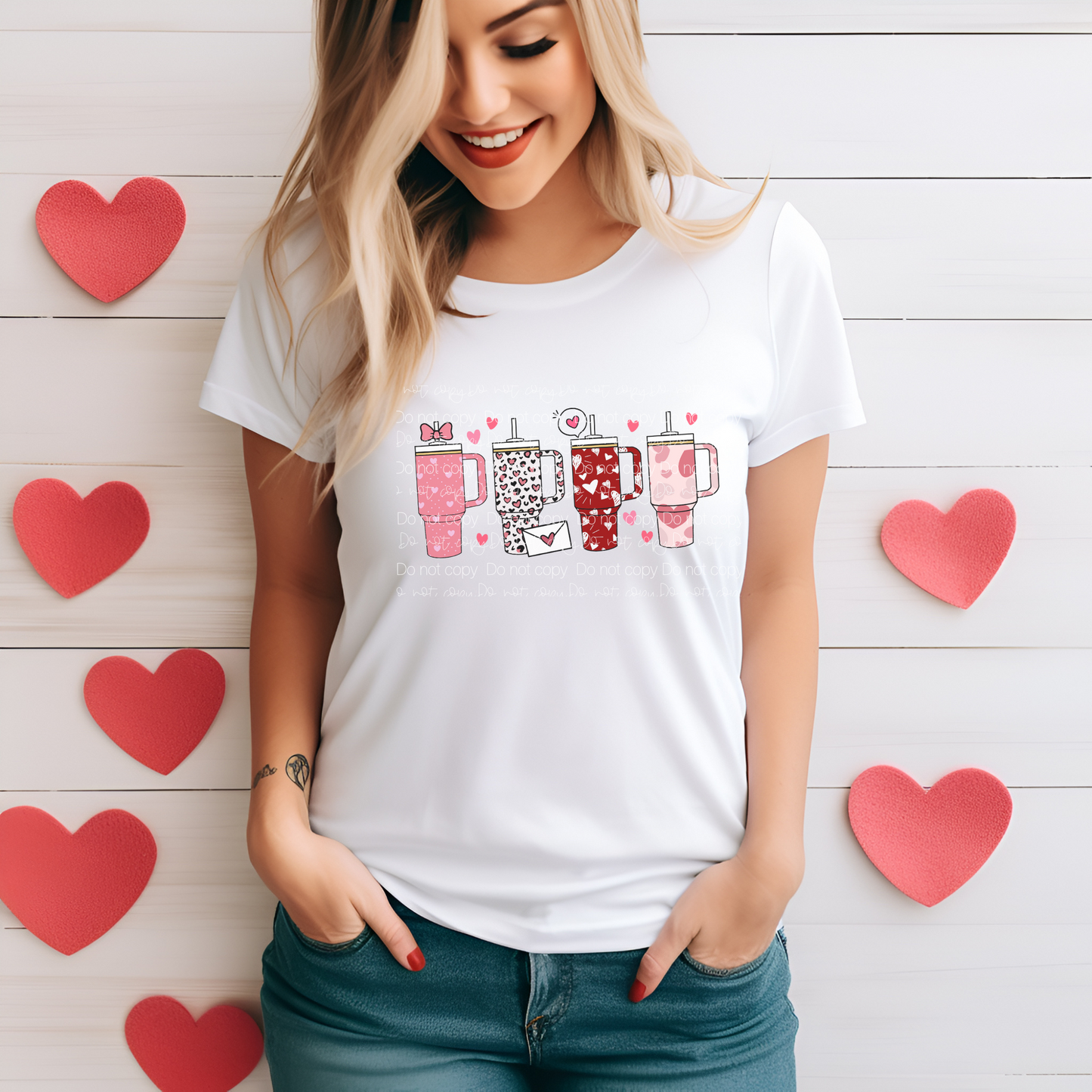 A person wearing a white t-shirt with a Valentine's Day themed graphic print.