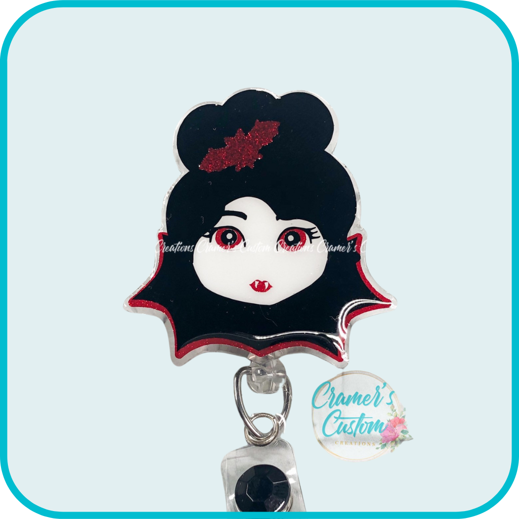 a girl with black hair, vampire teeth, and a red bat in her hair