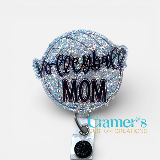 Glittery badge holder with 'Volleyball Mom' text on a white background, featuring Cramer's Custom Creations logo.