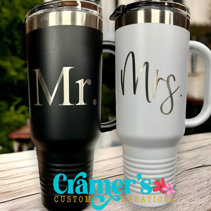 two 40oz tumblers, one white, one black with Mr and Mrs sitting on a white counter