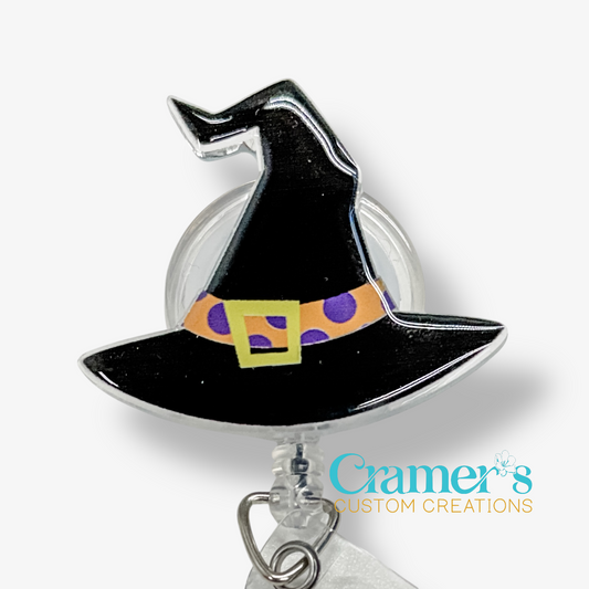 Witch hat badge holder with colorful belt on a white background, featuring the brand 'Cramer's Custom Creations'.