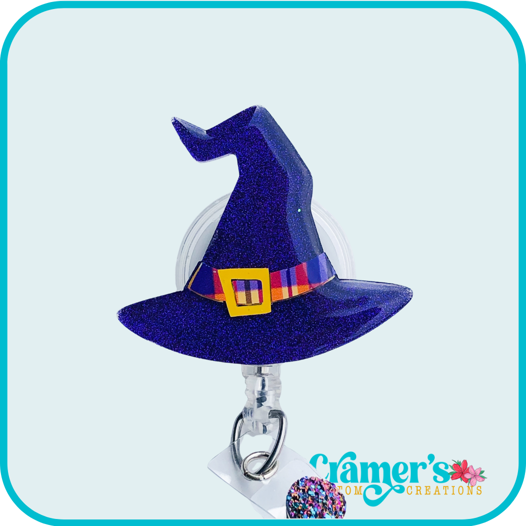 purple glitter hat with a purple/orange plaid band around it.