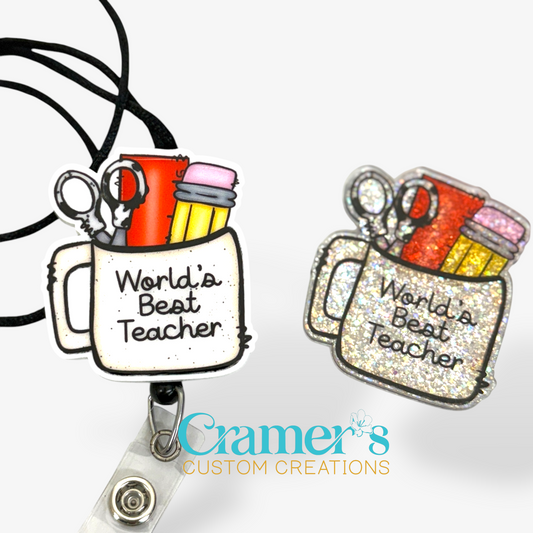 2 badge reels showing a glitter and non glitter option of a badge with a coffee mug filled with teacher items and the words worlds best teacher