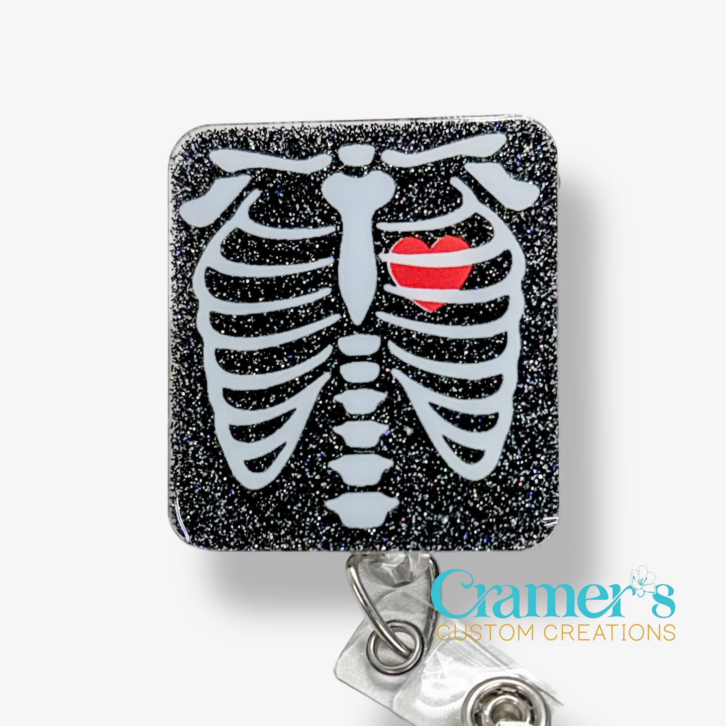 Skeletal design with a red heart on a glittery black background, featuring 'Cramer's Custom Creations' branding.