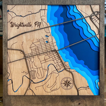 Wood multi layered map of wrightsville pa painted to show river depth and the streets in the town