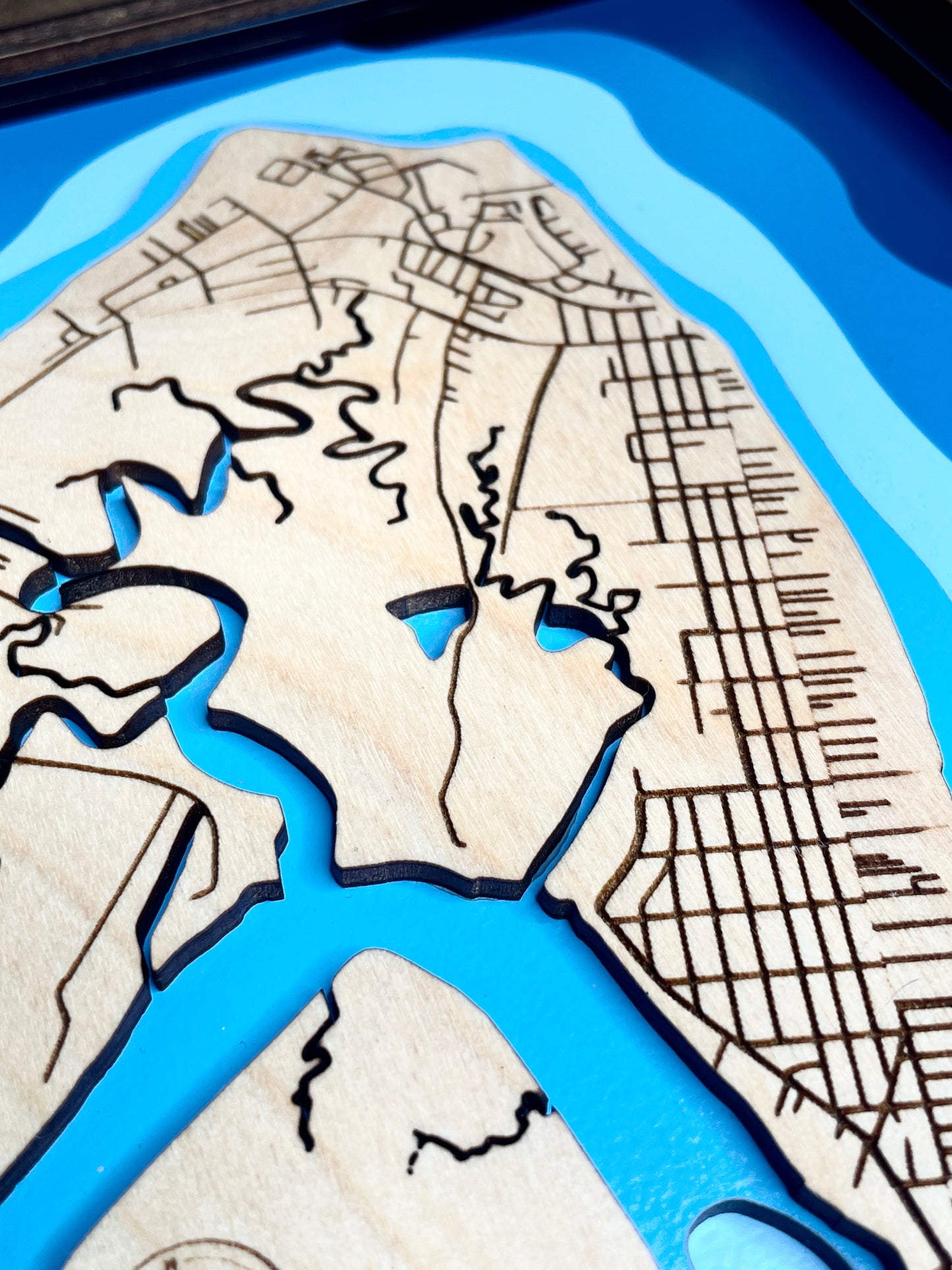 One view of a wood bathymetric map showing water ways of tybee, painted with to show depth