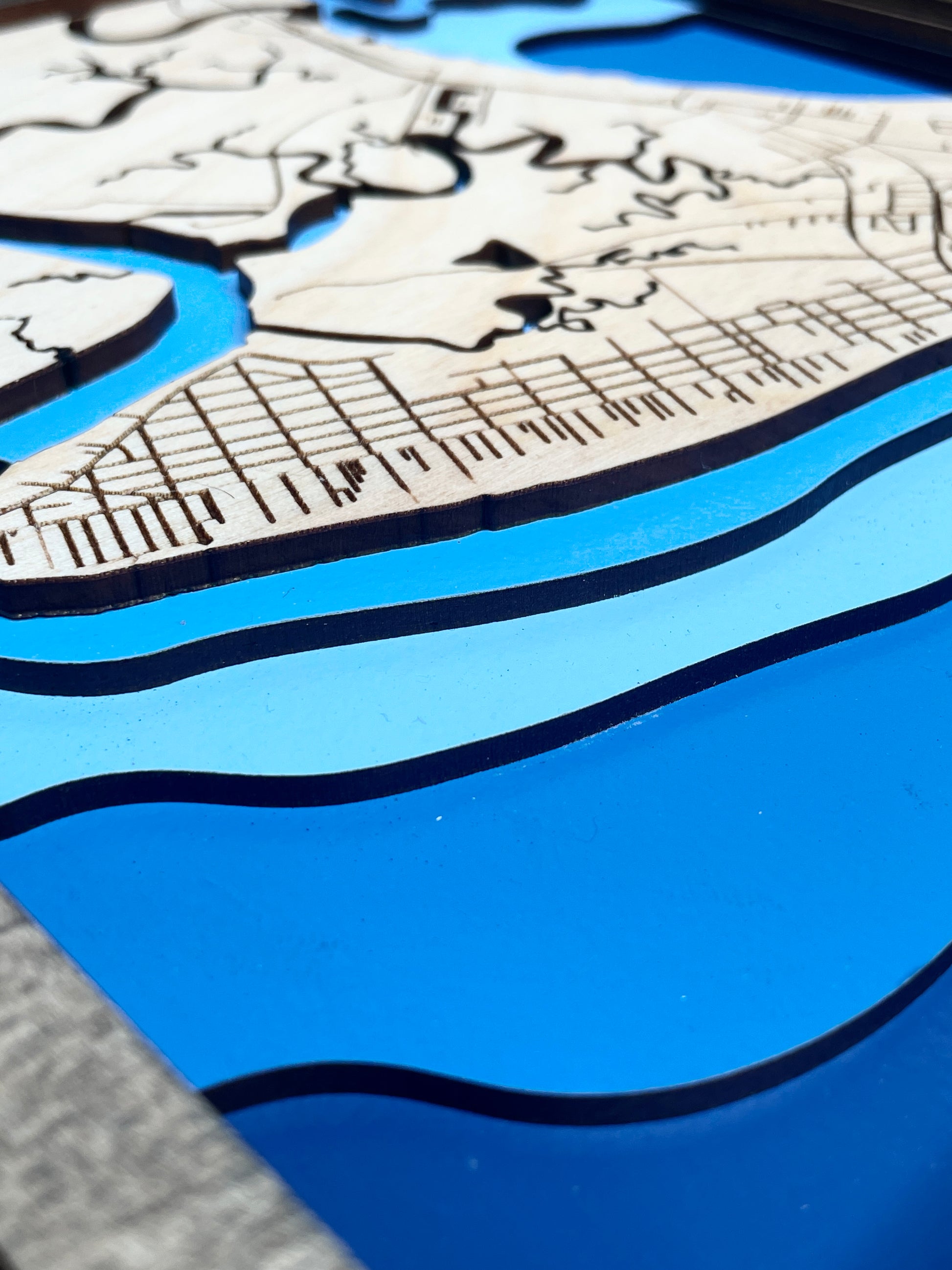 One view of a wood bathymetric map showing water ways of tybee, painted with to show depth